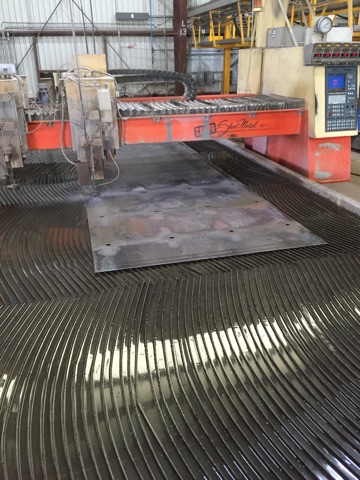 Water jet cut holes in sheet